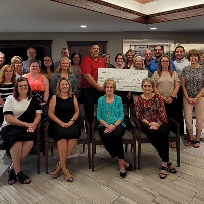 CNB and STEP representatives with the 2023 STEP Up Supporter check