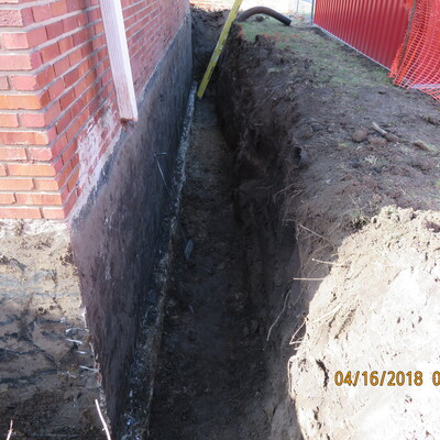 Flashing will protect waterproofing membrane around basement of military museum