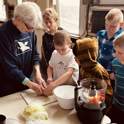Grandmas and grandpas are welcome in the classroom too. Education is inter-generational here.