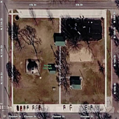 Aerial view today. Before, parking was gravel and more narrow, & the only sidewalk was along N 10th